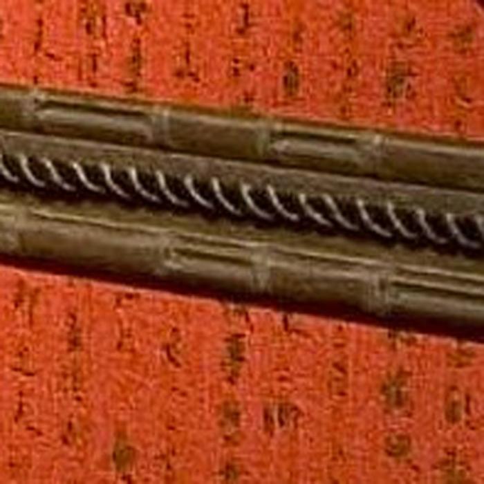 Close Up of bamboo and rope cording chair rail.